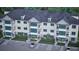 Exterior view of a multi-unit building with parking at 7421 Indigo Palms Way, Johns Island, SC 29455