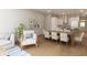 Bright dining area with large wooden table and seating for eight at 7421 Indigo Palms Way, Johns Island, SC 29455