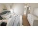 Spacious bedroom with light wood floors and a dresser at 7421 Indigo Palms Way, Johns Island, SC 29455