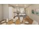 Modern white kitchen with island and stainless steel appliances at 7421 Indigo Palms Way, Johns Island, SC 29455