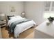 Bright bedroom with queen-size bed and white dresser at 7421 Indigo Palms Way, Johns Island, SC 29455