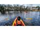Community lake with multiple kayaks for recreation at 1044 Lovebug Ln, Summerville, SC 29485