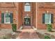 Brick building with double glass doors, black shutters, and a walkway at 1443 Cambridge Lakes Dr, Mount Pleasant, SC 29464