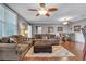 Spacious living room with hardwood floors, comfortable seating, and ceiling fan at 1443 Cambridge Lakes Dr, Mount Pleasant, SC 29464