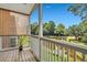 Relaxing screened porch overlooking a pond and lush greenery at 1443 Cambridge Lakes Dr, Mount Pleasant, SC 29464