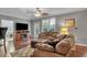Open living area featuring hardwood floors, a fireplace, and a cozy seating arrangement at 1443 Cambridge Lakes Dr, Mount Pleasant, SC 29464