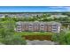 Aerial view of community, showcasing apartment buildings, pool, and landscaping at 1443 Cambridge Lakes Dr, Mount Pleasant, SC 29464