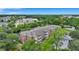 Aerial view of apartment building near a pond with green surroundings at 1443 Cambridge Lakes Dr, Mount Pleasant, SC 29464