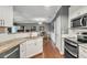 Updated kitchen featuring white shaker cabinets, granite countertops, and stainless steel appliances at 1443 Cambridge Lakes Dr, Mount Pleasant, SC 29464