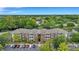 Aerial view of apartment community with pond, parking, and lush landscaping at 1443 Cambridge Lakes Dr, Mount Pleasant, SC 29464