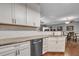 Modern kitchen with white cabinets, granite countertops, and a large island at 1443 Cambridge Lakes Dr, Mount Pleasant, SC 29464