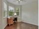 Home office with hardwood floors and built-in desk at 1443 Cambridge Lakes Dr, Mount Pleasant, SC 29464