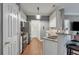 Modern kitchen with white cabinets, granite countertops, and stainless steel appliances at 1443 Cambridge Lakes Dr, Mount Pleasant, SC 29464