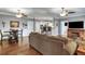 Open concept living space with hardwood floors, a dining area, and a view into the kitchen at 1443 Cambridge Lakes Dr, Mount Pleasant, SC 29464