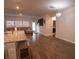 Open concept living room with hardwood floors and large windows at 217 Pink Azalea St, Summerville, SC 29485