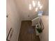Bright entryway with chandelier, staircase, and wood flooring at 217 Pink Azalea St, Summerville, SC 29485