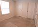 Simple bedroom with carpet, neutral walls, and two closets at 217 Pink Azalea St, Summerville, SC 29485