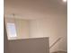 Upstairs landing with window and neutral wall colors at 217 Pink Azalea St, Summerville, SC 29485