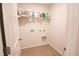 Laundry room with washer and dryer hookups and shelving at 217 Pink Azalea St, Summerville, SC 29485