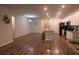 Open concept kitchen features island, stainless steel appliances, and white cabinetry at 217 Pink Azalea St, Summerville, SC 29485