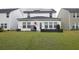 Spacious backyard with green lawn and solar panels at 217 Pink Azalea St, Summerville, SC 29485