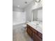 Bathroom with tub, shower, and brown vanity at 1604 Crossbill Trl, Hanahan, SC 29410