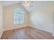 Bright bedroom with vaulted ceiling, wood floors, and an arched window at 195 Fox Squirrel Run, Summerville, SC 29483