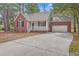 Brick house with attached garage and driveway at 195 Fox Squirrel Run, Summerville, SC 29483