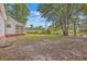 Large backyard with a partial view of the house at 195 Fox Squirrel Run, Summerville, SC 29483