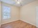 Simple bedroom with wood floors and a window with blinds at 195 Fox Squirrel Run, Summerville, SC 29483