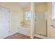 Bathroom features a jetted tub, walk-in shower, and wood-look floors at 195 Fox Squirrel Run, Summerville, SC 29483