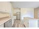 Modern kitchen with white cabinets, stainless steel appliances and island at 195 Fox Squirrel Run, Summerville, SC 29483