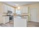 Updated kitchen with white cabinets, stainless steel appliances, and an island at 195 Fox Squirrel Run, Summerville, SC 29483