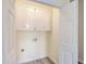 Convenient laundry room with upper cabinets and vinyl flooring at 195 Fox Squirrel Run, Summerville, SC 29483