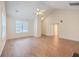Open living room with hardwood floors, vaulted ceiling and access to other rooms at 195 Fox Squirrel Run, Summerville, SC 29483