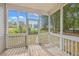 Relaxing screened porch with wooden deck overlooking backyard at 195 Fox Squirrel Run, Summerville, SC 29483