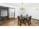 Dining room with hardwood floors, chandelier, and a small table set at 225 Cantering Hills Ln, Summerville, SC 29483