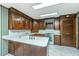Kitchen with wood cabinets, white countertops, and stainless steel appliances at 225 Cantering Hills Ln, Summerville, SC 29483