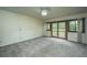 Bedroom with neutral carpet and sliding glass doors leading to deck at 225 Cantering Hills Ln, Summerville, SC 29483