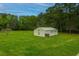 Large backyard with detached garage and lush lawn at 225 Cantering Hills Ln, Summerville, SC 29483
