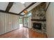 Living room featuring hardwood floors, stone fireplace, and access to a patio at 225 Cantering Hills Ln, Summerville, SC 29483