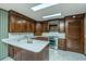 Kitchen boasts ample wood cabinets and a large island with sink at 225 Cantering Hills Ln, Summerville, SC 29483