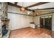 Living room with hardwood floors, wood-paneled walls, and a fireplace at 225 Cantering Hills Ln, Summerville, SC 29483