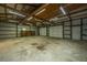 Large workshop with double garage doors and shelving units at 225 Cantering Hills Ln, Summerville, SC 29483