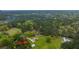 Aerial view of house on a large lot with a detached shop and wooded area at 225 Cantering Hills Ln, Summerville, SC 29483