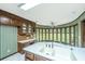 Kitchen features a sunroom with multiple windows and backyard view at 225 Cantering Hills Ln, Summerville, SC 29483