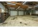 Workshop with double garage doors and ample storage shelving at 225 Cantering Hills Ln, Summerville, SC 29483