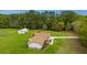 Aerial view of a house, detached garage, and expansive lawn with surrounding trees at 225 Cantering Hills Ln, Summerville, SC 29483