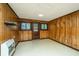 Unfinished basement room with wood paneling and exterior access at 225 Cantering Hills Ln, Summerville, SC 29483
