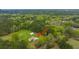 Aerial view of house and property with large yard, detached shop, and surrounding trees at 225 Cantering Hills Ln, Summerville, SC 29483